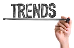 Hand with marker writing the word Trends - ERP Trends