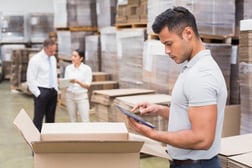 Portrait of male manager using digital tablet in warehouse-3