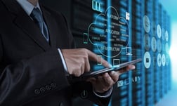 businessman hand using tablet computer and server room background, e-commerce for manufacturers